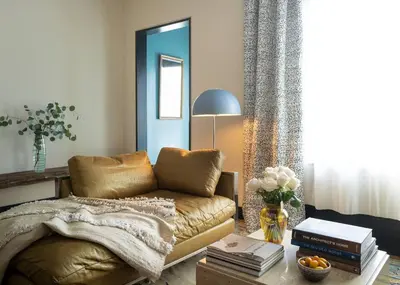 a living room with a couch and a table at Elegant Townhouse, Hudson center, 3 ensuite baths in Hudson