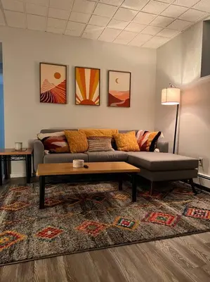 a living room with a couch and a coffee table at Modern, Cozy Hudson Valley Escape 1 Hr From NYC in Putnam Valley