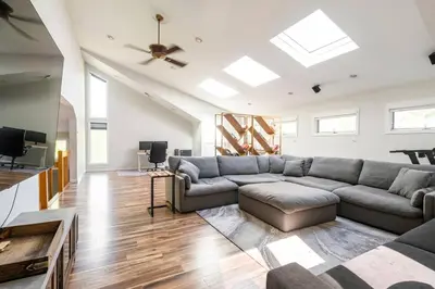 a living room with a couch and a tv at Modern, Cozy Hudson Valley Escape 1 Hr From NYC in Putnam Valley