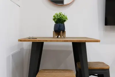 a table with a potted plant on top of it at 78-3C Newly renovated 1BR WD Walk 2 Central Park in New York