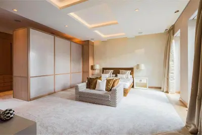 a living room with a couch and a bed at Rasila SoHo in New York