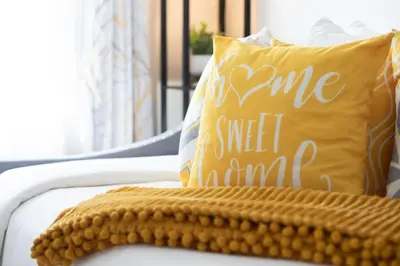 a pillow that says some sweet mum sitting on a chair at Entire House Right In Stamford's Heart in Stamford