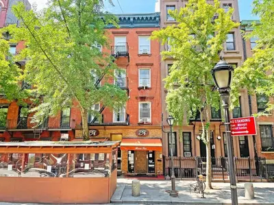 a street light in front of a building at Elevate Apartment at Times Square - Cozy Studio in Times Square and Nearby Restaurants in New York