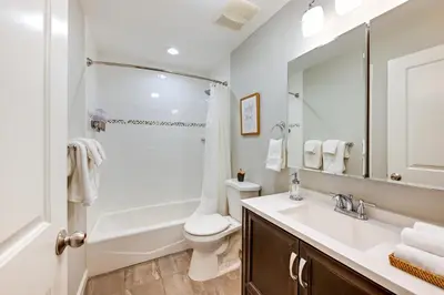 a bathroom with a sink and a toilet and a shower at Glen Cove Vacation Rental Less Than 1 Mi to Downtown! in Glen Cove