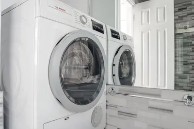two washing machines sitting next to each other in a room at West Village 1br w high ceilings skylight wd NYC-1172 in New York