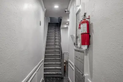 a stairway with a fire hydrant on the side of a building at West Village 1br w high ceilings skylight wd NYC-1172 in New York