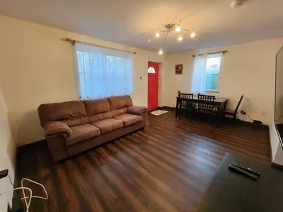 a living room with a couch and a table at RentalsOP NJ01 Full house minutes from NYC, near to metlife, American Dream in Hackensack
