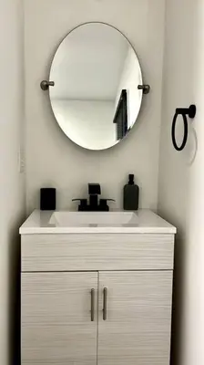 a bathroom with a white sink and a mirror at Hudson Haven in Hudson