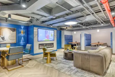 a living room with blue walls and a flat screen tv at Midtown East 1br w doorman nr Grand Central NYC-1170 in New York
