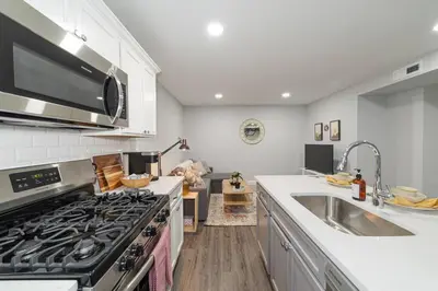 a kitchen with a stove and a sink at Suite Dreams 2BR Parking Yale New Haven Lawn Club in New Haven