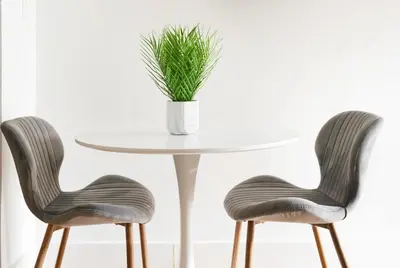 two chairs and a white table with a potted plant at 444-3F Newly renovated 1BR in Hell's Kitchen in New York