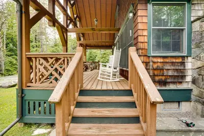 a front porch of a house with a wooden stairway at Secluded Elka Park Cabin Hot Tub and Fire Pit! in Elka Park