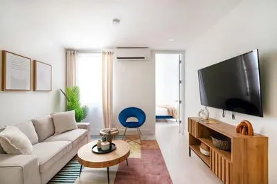 a living room with a couch and a flat screen tv at 78-4A 2BR Duplex with a Balcony Prime UES in New York