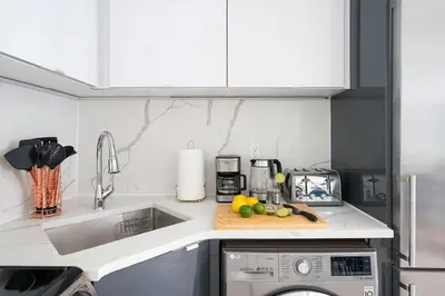 a kitchen with a sink and a counter top at 78-4A 2BR Duplex with a Balcony Prime UES in New York
