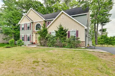 a house with a large yard in front of it at Woodsy Ballston Spa Home 4 Mi to State Park! in Ballston Spa