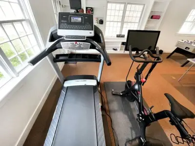 a room with a desk with a computer on it at Cottage Retreat - Historic Cottage Home w Home Gym in Cornwall