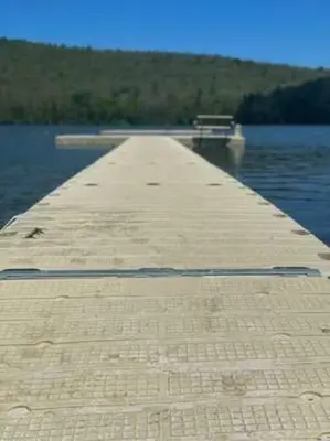 a long dock on a body of water at Cottage Retreat - Historic Cottage Home w Home Gym in Cornwall