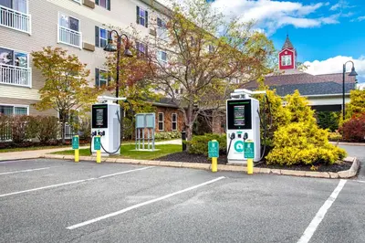 a street with two parking meters in front of a building at Berkshire Mountain Lodge in Pittsfield