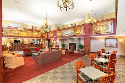 a large living room with furniture and a fireplace at Berkshire Mountain Lodge in Pittsfield