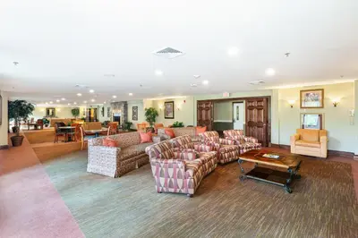 a large living room with couches and a table at Berkshire Mountain Lodge in Pittsfield