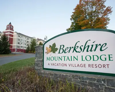 a sign for the entrance to a mountain lodge at Berkshire Mountain Lodge in Pittsfield