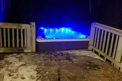 a bath tub with blue lights in a room at Catskill Mountain Retreat in West Kill