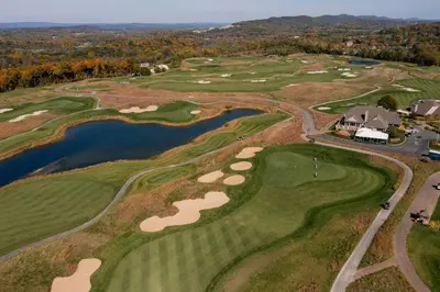 an aerial view of a golf course with a pond at Cozy 2BR condo w/ valley views in Vernon Township