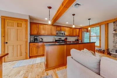 a living room with a couch and a kitchen at 219 Old Ark Road in Wilmington