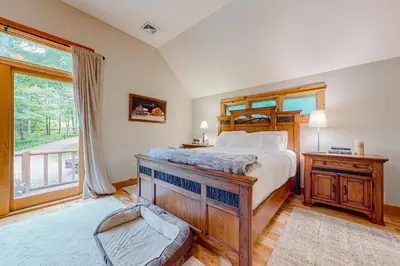a bedroom with a bed and a large window at 219 Old Ark Road in Wilmington