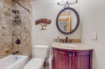 a bathroom with a sink and a toilet and a mirror at 219 Old Ark Road in Wilmington