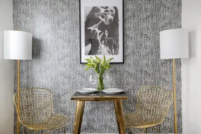 a dining room with a table and two chairs at Perfectly located 2BD near Times Square with Gym in New York