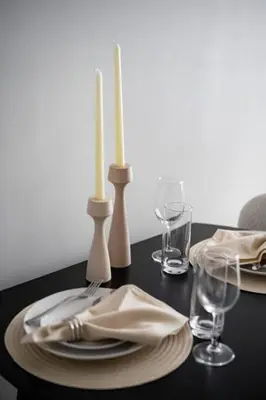a table with two candles and plates and glasses at Stunning 2BD Penthouse in Chelsea w Washer and Dryer in New York