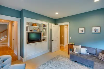 a living room with a couch and a tv at Stockbridge Retreat with Pool and Hot Tub! in Stockbridge