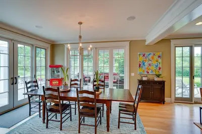 a dining room with a table and chairs at Stockbridge Retreat with Pool and Hot Tub! in Stockbridge