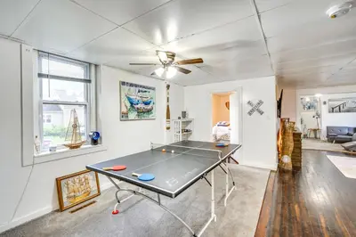 a ping pong table in the middle of a room at Cozy Berkshires Vacation Rental Near Hiking! in Chester