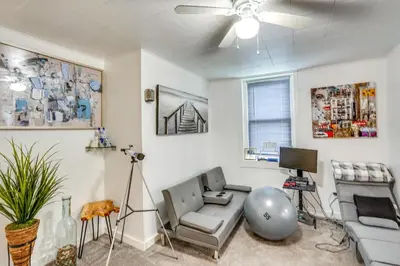 a living room with a couch and a tv at Cozy Berkshires Vacation Rental Near Hiking! in Chester