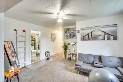 a living room with a couch and a ceiling fan at Cozy Berkshires Vacation Rental Near Hiking! in Chester
