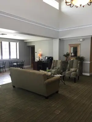 a living room with a couch and chairs at Belvedere Inn Schenectady - Albany in Schenectady