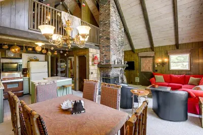 a kitchen and living room with a table and a couch at West Dover Home - Steps to Mount Snow Resort! in West Dover