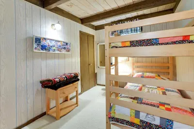 a bedroom with two bunk beds in a room at West Dover Home - Steps to Mount Snow Resort! in West Dover
