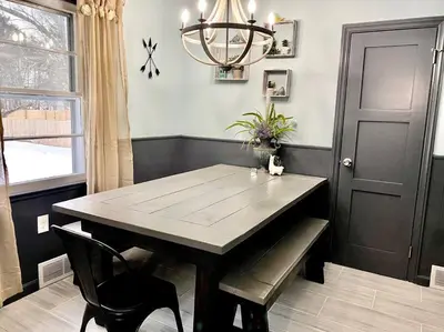 a dining room with a table and chairs and a chandelier at Rustic Elegance 3BDR Stylish Farmhouse Getaway in Schenectady