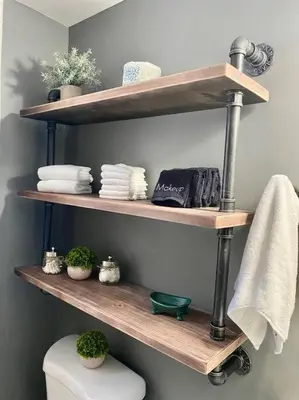 a bathroom with wooden shelves above a toilet at Rustic Elegance 3BDR Stylish Farmhouse Getaway in Schenectady