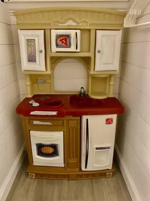 a toy kitchen with a sink and appliances at Rustic Elegance 3BDR Stylish Farmhouse Getaway in Schenectady