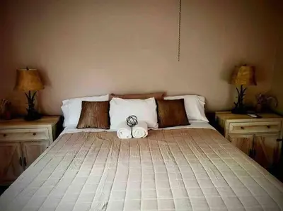 a bed with two stuffed animals sitting on top of it at Upstate getaway. Leave your troubles behind. in Unadilla