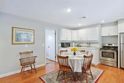 a dining room with a table and chairs in a kitchen at Connecticut Retreat Steps to Historic Downtown! in Litchfield