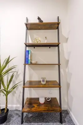 a wooden shelf with a coffee cup on it at Saratoga Serenity: Charming Rental Nearby Downtown in Saratoga Springs