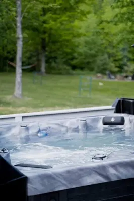 a hot tub with water in a park at The Norsdale plus CMYK Motel on 10 acres in Phoenicia in Phoenicia