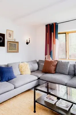 a living room with a couch and a glass table at The Norsdale plus CMYK Motel on 10 acres in Phoenicia in Phoenicia