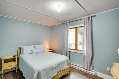 a small bedroom with a bed and a window at Monterey Haven Less Than half Mi to Lake Garfield with Kayaks in Monterey