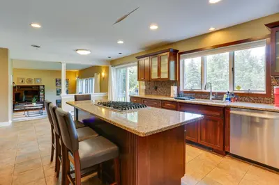 a kitchen with a large island with a counter top at Warwick Vacation Rental with Private Yard and Fire Pit in Warwick